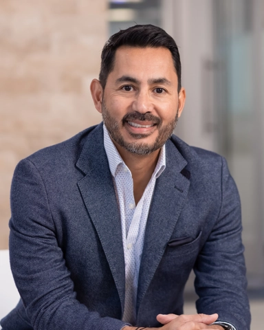 portrait of a smiling person in professional attire